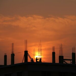 Silhouette of Men in Construction Site during Sunset